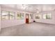 Spacious living room features pink walls, gray carpet and lots of windows at 4140 E Glenrosa Ave, Phoenix, AZ 85018