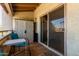 Enclosed balcony with outdoor furniture and storage closet, perfect for relaxation at 4150 E Cactus Rd # 205, Phoenix, AZ 85032