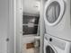 Bathroom with tiled walls, updated fixtures, and a stacked washer/dryer at 4150 E Cactus Rd # 205, Phoenix, AZ 85032