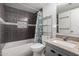 Full bathroom features a tiled shower/tub combination and neutral vanity at 4150 E Cactus Rd # 205, Phoenix, AZ 85032