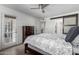 Bright bedroom with outside access, wood flooring, and access to the bathroom at 4150 E Cactus Rd # 205, Phoenix, AZ 85032