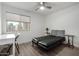 Clean bedroom with a large window, a daybed, and wood flooring at 4150 E Cactus Rd # 205, Phoenix, AZ 85032