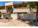 Exterior view of a two-story building with private entrances and well-maintained landscaping at 4150 E Cactus Rd # 205, Phoenix, AZ 85032