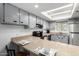 Bright kitchen features granite countertops, neutral cabinets and a breakfast bar at 4150 E Cactus Rd # 205, Phoenix, AZ 85032