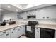 Well-lit kitchen features light cabinets, modern appliances, and ample counter space at 4150 E Cactus Rd # 205, Phoenix, AZ 85032