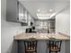 Updated kitchen with sleek countertops, stainless steel appliances, and stylish bar seating at 4150 E Cactus Rd # 205, Phoenix, AZ 85032
