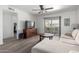 Bright living room with modern flooring, neutral tones, and sliding door to a balcony at 4150 E Cactus Rd # 205, Phoenix, AZ 85032