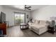 Bright living room with modern flooring, neutral tones, and sliding door to a balcony at 4150 E Cactus Rd # 205, Phoenix, AZ 85032