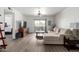 Spacious living room with modern flooring, neutral tones, and sliding door to a balcony at 4150 E Cactus Rd # 205, Phoenix, AZ 85032
