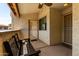 Inviting outdoor patio features a cozy bench and a secure entrance to the home at 4150 E Cactus Rd # 205, Phoenix, AZ 85032