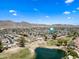 Beautiful aerial view showcases a neighborhood with lush green spaces and a serene pond at 4252 E Zia St, Phoenix, AZ 85044