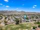 Expansive aerial view of a residential community nestled against scenic mountain backdrop under a clear blue sky at 4252 E Zia St, Phoenix, AZ 85044