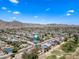 Overhead view of a quiet suburban neighborhood with well-maintained lawns and mature trees at 4252 E Zia St, Phoenix, AZ 85044