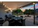 Inviting outdoor space with a covered patio and beautifully landscaped backyard at dusk at 4252 E Zia St, Phoenix, AZ 85044