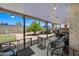 Covered patio with seating area and a well-maintained backyard, perfect for outdoor enjoyment at 4252 E Zia St, Phoenix, AZ 85044