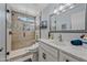 Updated bathroom featuring a glass shower, marble countertops, and modern fixtures at 4252 E Zia St, Phoenix, AZ 85044