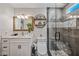 Bathroom with walk-in shower, marble vanity, and sleek fixtures at 4252 E Zia St, Phoenix, AZ 85044