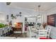 Open dining and living area with bar seating and hardwood floors at 4252 E Zia St, Phoenix, AZ 85044