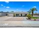 Charming single-story home with well-maintained landscaping and inviting curb appeal on a sunny day at 4252 E Zia St, Phoenix, AZ 85044