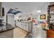 Open-concept kitchen featuring granite countertops and seamless transition to the living area with a fireplace at 4252 E Zia St, Phoenix, AZ 85044