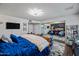 Spacious main bedroom featuring a plush bed, mirrored closet, and adjacent sitting area, offering comfort and style at 4252 E Zia St, Phoenix, AZ 85044