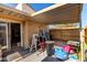 Covered back patio, offering shade and space for outdoor activities and relaxation at 4814 W Rose Ln, Glendale, AZ 85301
