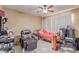 Cluttered bedroom with ceiling fan and large window for natural light at 4814 W Rose Ln, Glendale, AZ 85301