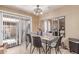 Elegant dining area with large sliding glass door and modern furnishings at 4814 W Rose Ln, Glendale, AZ 85301