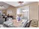 Open dining room that flows to the living room, filled with natural light at 4814 W Rose Ln, Glendale, AZ 85301