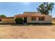 Cozy home featuring a classic tiled roof and a simple, welcoming facade at 4814 W Rose Ln, Glendale, AZ 85301