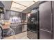 Cozy kitchen features stainless steel appliances and dark cabinets at 4814 W Rose Ln, Glendale, AZ 85301