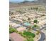 Aerial view of the community showcases lush landscaping, a community pool and convenient access to highways at 4918 W Wahalla Ln, Glendale, AZ 85308