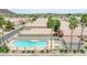 Aerial view of a community pool and neighboring houses at 4918 W Wahalla Ln, Glendale, AZ 85308