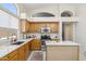 Bright kitchen features a breakfast bar, stainless steel appliances, and ample counter space at 4918 W Wahalla Ln, Glendale, AZ 85308