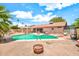 Backyard pool and patio area with pergola, desert landscaping, and home exterior at 5140 N 69Th Ave, Glendale, AZ 85303