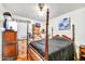 Bedroom with storage and shelving around the walls, and a four poster bed at 5140 N 69Th Ave, Glendale, AZ 85303