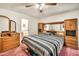 Bedroom with a large bed, built in cabinets, and access to an ensuite bathroom at 5140 N 69Th Ave, Glendale, AZ 85303