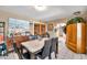 Dining area featuring tiled flooring, a dining table with seating for six, and wooden accents at 5140 N 69Th Ave, Glendale, AZ 85303