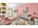 Inviting living room with pink walls, carpeted floors, and comfortable furnishings at 5140 N 69Th Ave, Glendale, AZ 85303