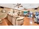Spacious living room with wood floors, comfortable seating, and entertainment center at 5140 N 69Th Ave, Glendale, AZ 85303