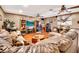 Spacious living room featuring hardwood floors, a large sofa, and entertainment center at 5140 N 69Th Ave, Glendale, AZ 85303