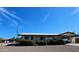 Single story home featuring desert landscaping, a carport and long driveway at 5414 E Albany St, Mesa, AZ 85205