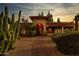 Stunning exterior with landscaped walkway, desert foliage, tile roof, and cozy, inviting entry at 6043 E Hearn Rd, Scottsdale, AZ 85254