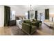 Spacious main bedroom with a king bed, sitting area, outdoor access and a chandelier at 6043 E Hearn Rd, Scottsdale, AZ 85254
