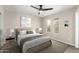 Bedroom features neutral paint, carpet flooring, fan, and natural light at 619 E Jensen St # 14, Mesa, AZ 85203