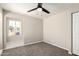 Bedroom with neutral paint, carpet flooring, window, and a ceiling fan at 619 E Jensen St # 14, Mesa, AZ 85203