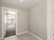 A cozy hallway featuring neutral paint and tile flooring at 619 E Jensen St # 14, Mesa, AZ 85203
