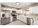 Updated kitchen featuring stainless steel appliances and ample counter space at 619 E Jensen St # 14, Mesa, AZ 85203