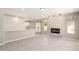 Open living room featuring a cozy fireplace and seamless flow to the kitchen at 619 E Jensen St # 14, Mesa, AZ 85203
