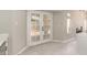 Living room featuring french doors to the back, flowing into the kitchen at 619 E Jensen St # 14, Mesa, AZ 85203